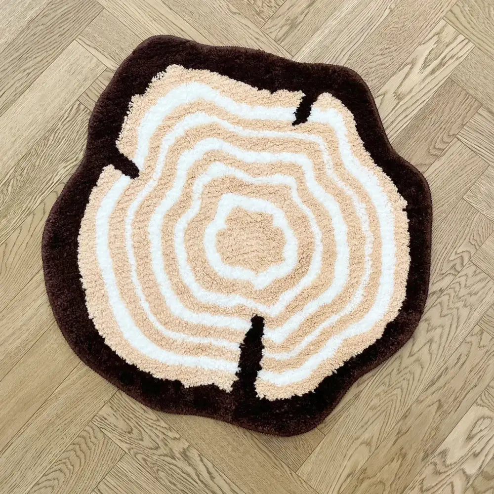 Tapis tronc d’arbre rond en peluche avec anneaux concentriques beige et blanc bordure marron foncé