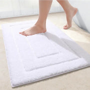 Tapis de bain blanc en éponge douce avec design rectangulaire texturé pour salle de bain confortable