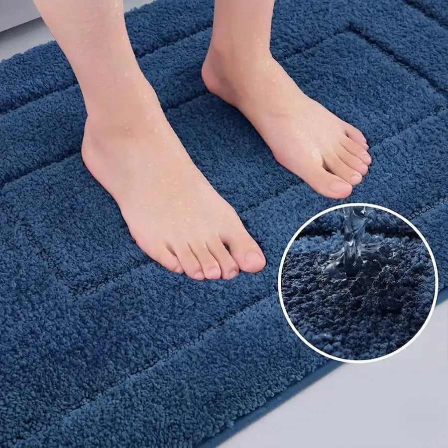 Tapis de bain bleu pétrole en éponge moelleuse avec texture matelassée et design résistant à l’eau pour bain bleu pétrole