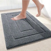 Tapis de bain gris anthracite en peluche avec design rectangulaire texturé et bordure surélevée pour salle de bain