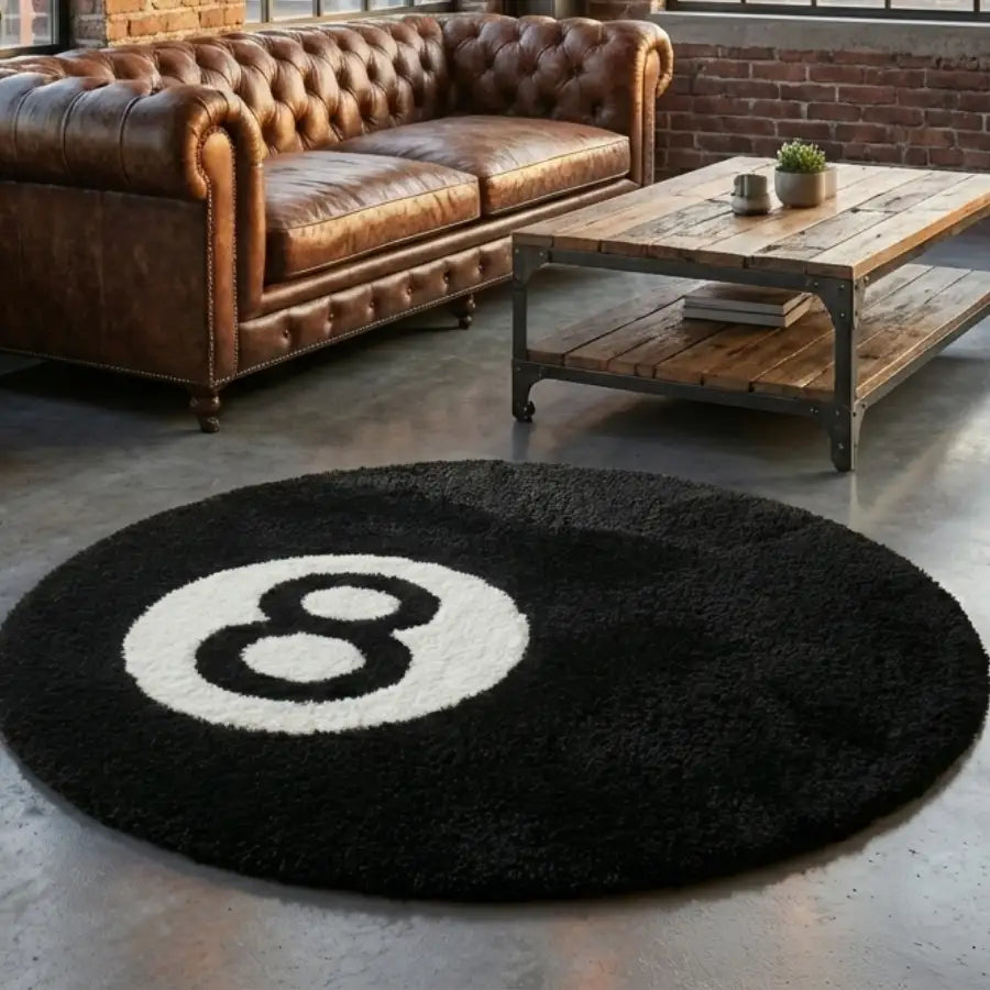 Tapis rond à thème boule 8 avec design noir et blanc, fabriqué en matériau moelleux.