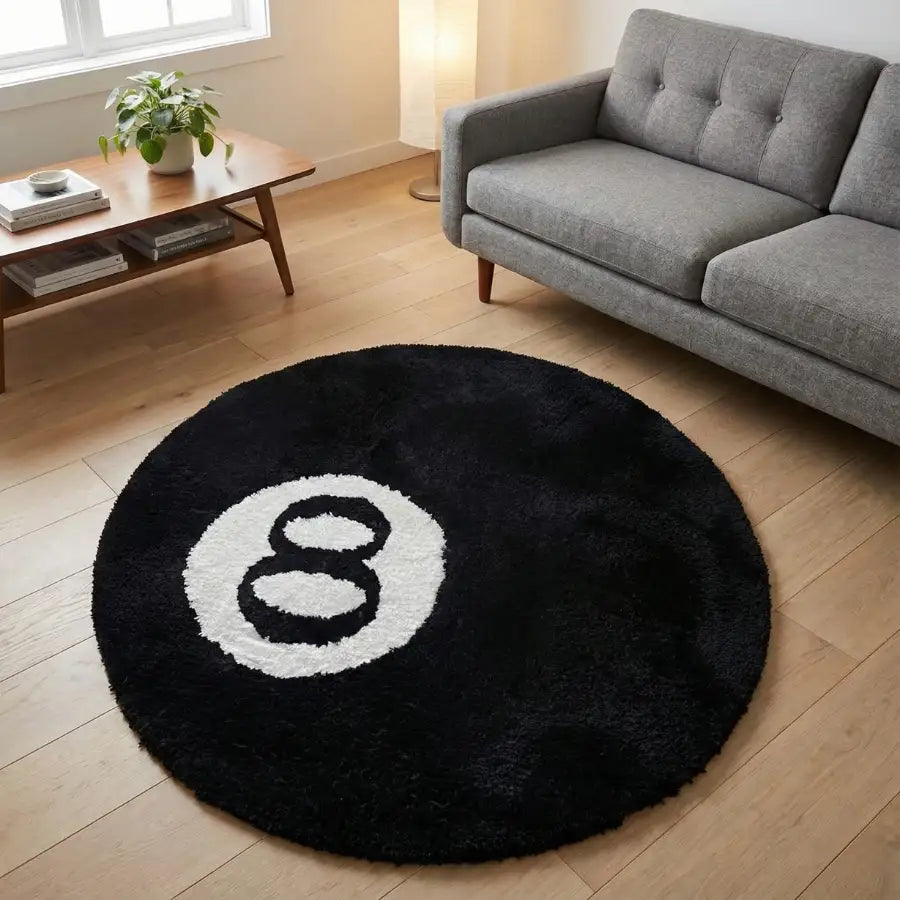 Tapis rond à thème boule 8 avec fond noir et design du numéro huit blanc.