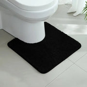 Tapis contour wc noir en peluche noire avec texture douce et bords arrondis pour bain noir confortable