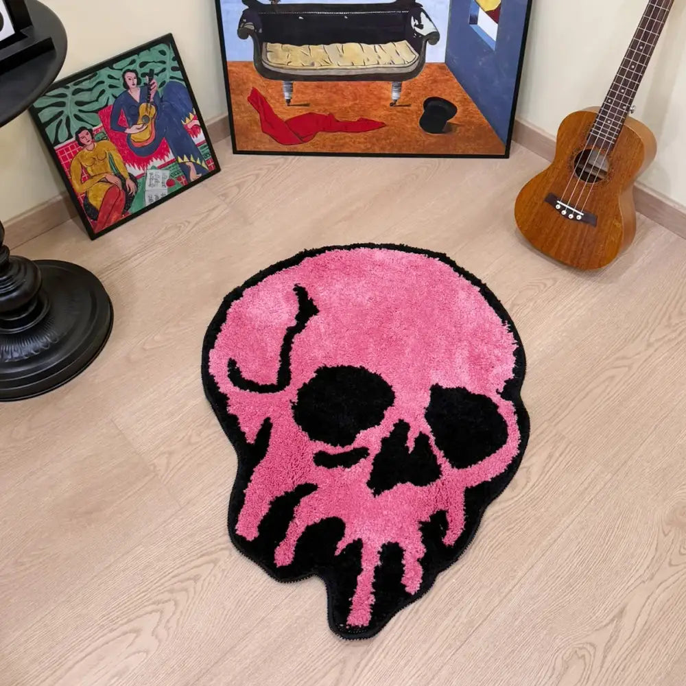 Tapis crâne rose avec contour noir, matériau moelleux.