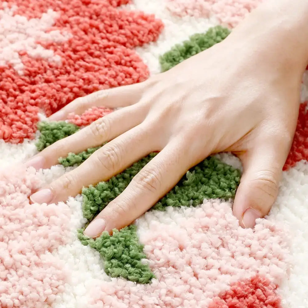 Tapis de bain texturé rose et vert avec velours épais.