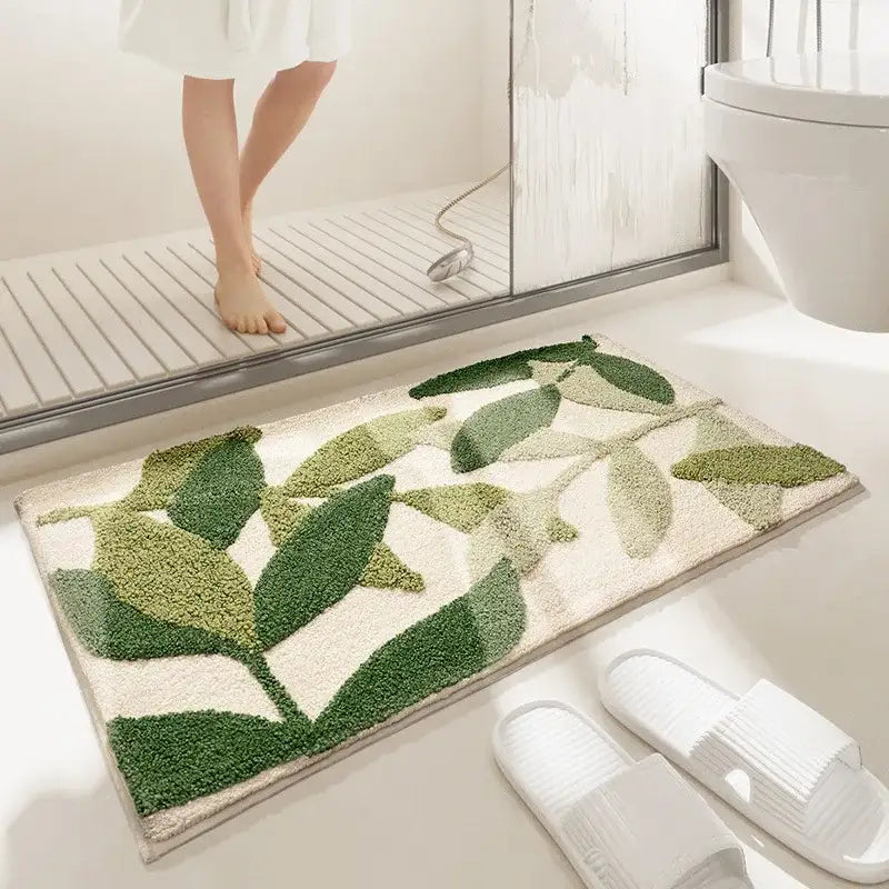 Tapis de bain à feuille verte avec design texturé, fabriqué en matériau moelleux.