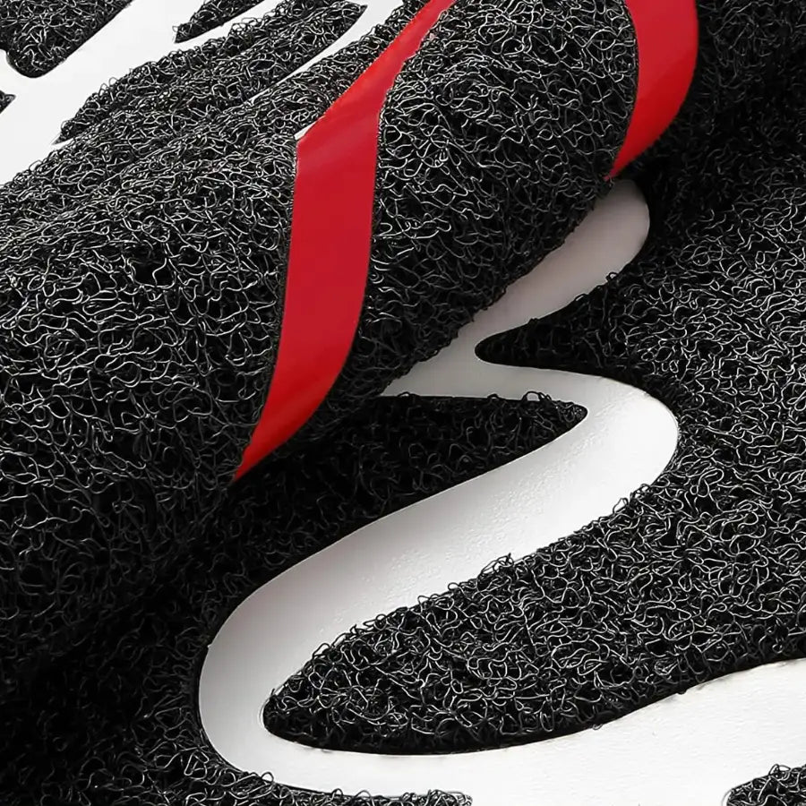 Gant de maille rouge et noir avec design de prise texturée