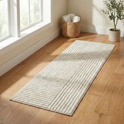 Tapis de bain texturé crème avec motif géométrique et texture tissée, probablement fabriqué à partir de fibres naturelles comme le jute ou le coton.