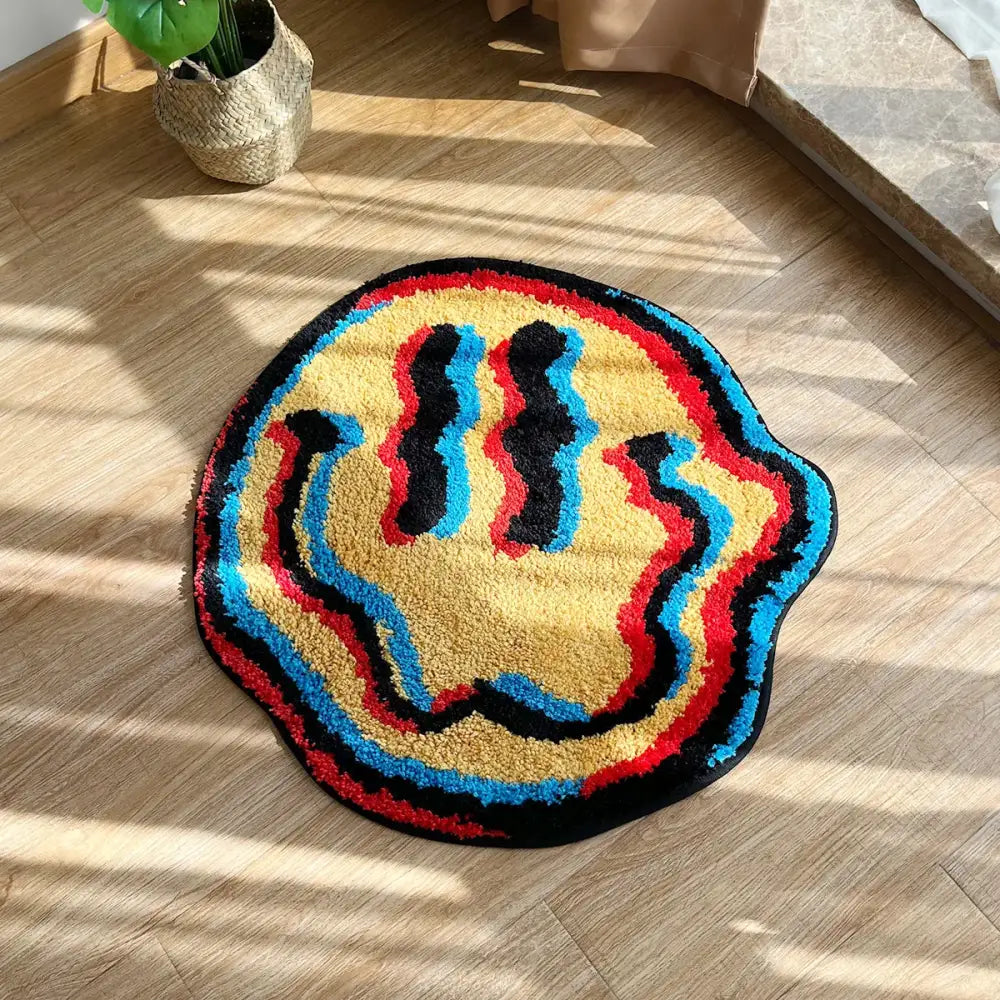 Tapis effet 3d rond en peluche avec design smiley coloré jaune rouge bleu et noir pour illusion d’optique