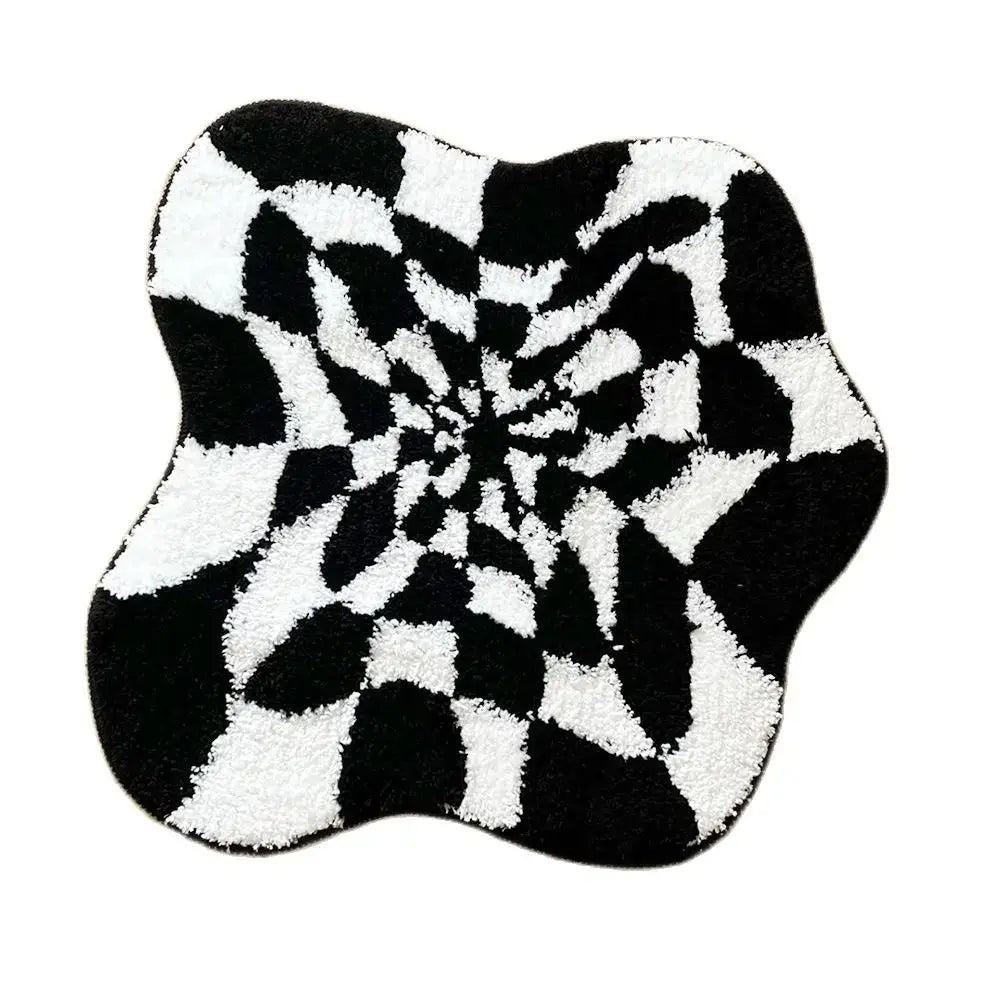 Tapis spiralé noir et blanc avec velours texturé.