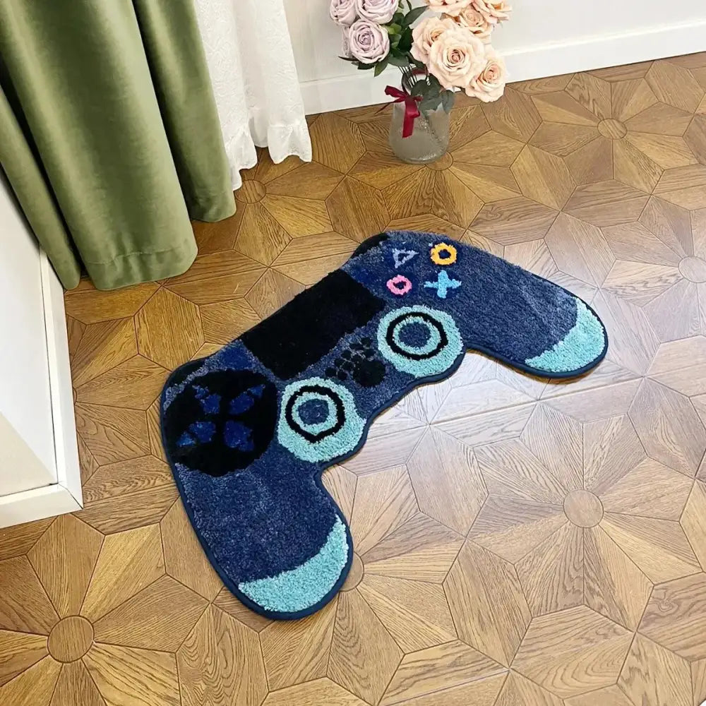 Tapis de contrôleur de jeu vidéo bleu et noir avec un design de boutons colorés, fabriqué en matériau moelleux.