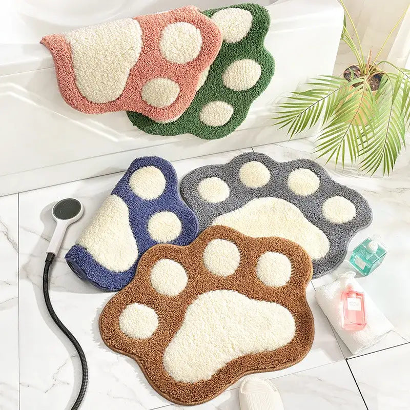 Tapis de bain empreinte de patte, multicolore, matériau moelleux avec design de pattes surélevé.