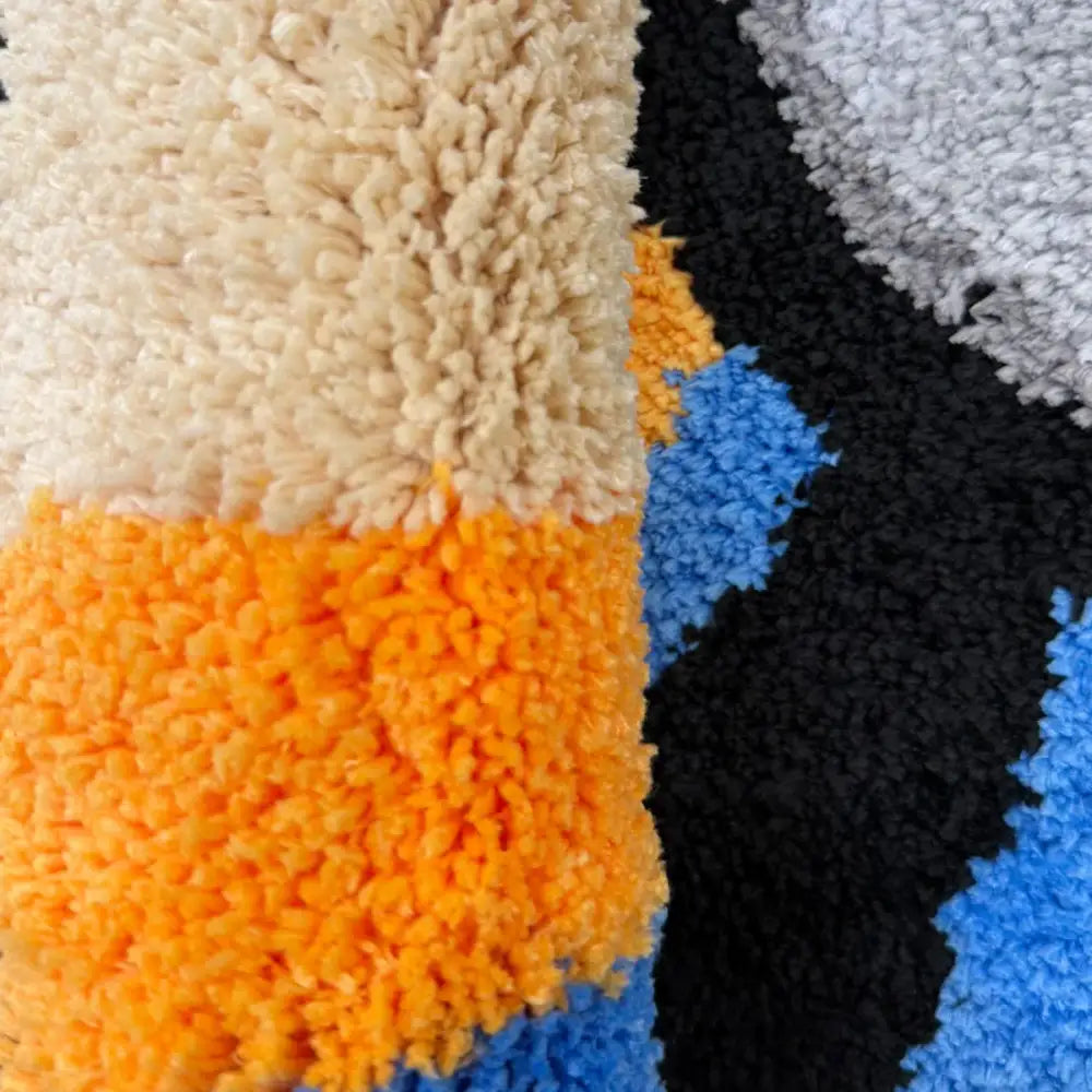 Couverture jetable floue orange et bleue avec un motif texturé.