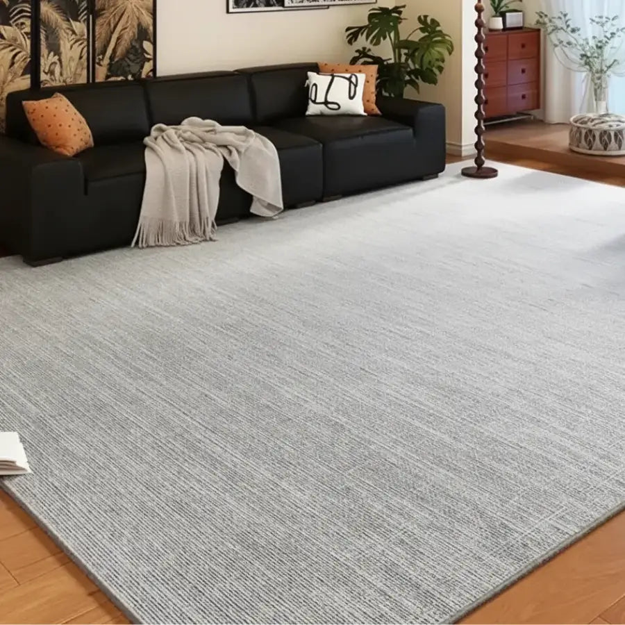 Tapis de zone texturé gris clair avec un design moderne et une sensation douce.