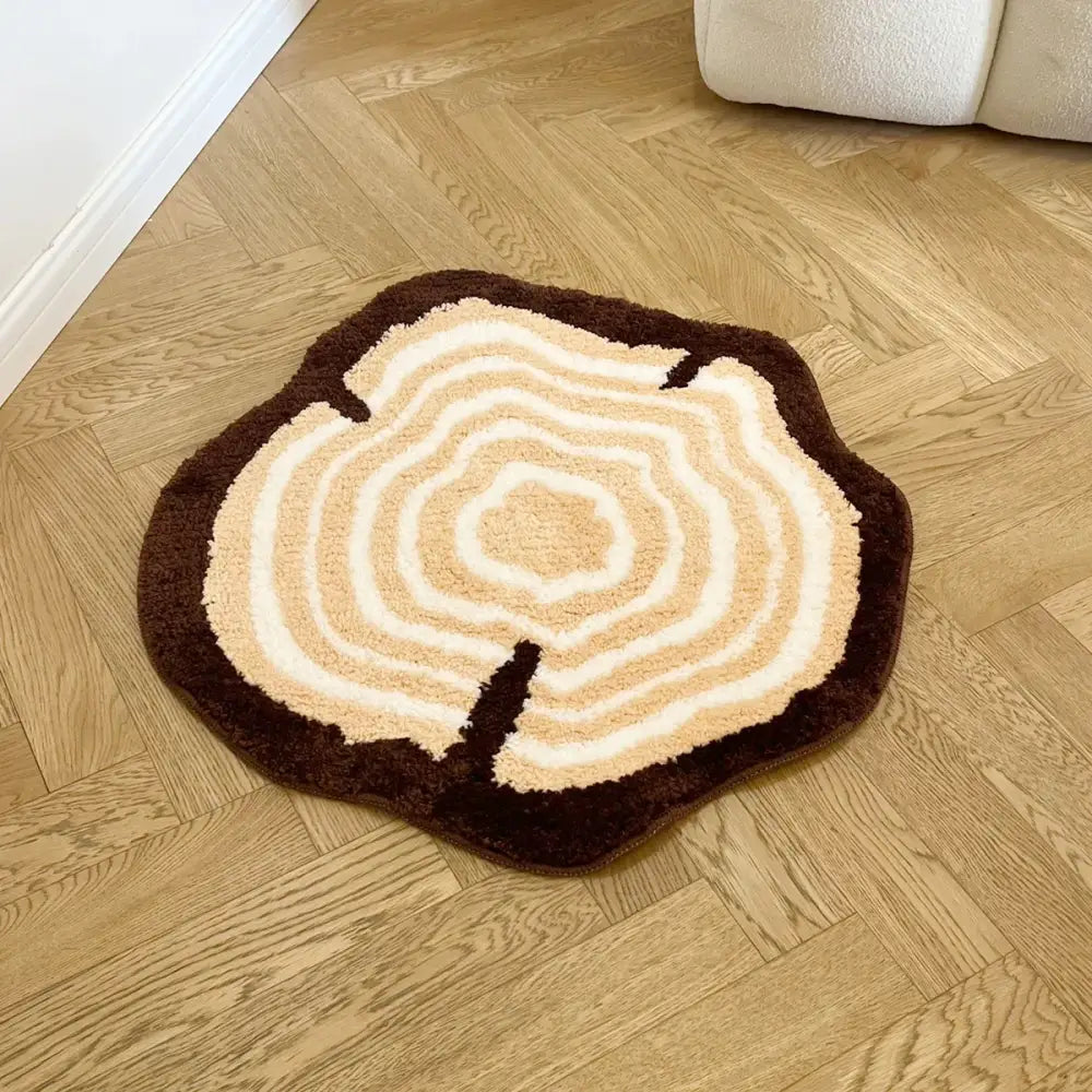 Tapis tronc d’arbre circulaire en peluche avec anneaux concentriques marron crème et support caoutchouc antidérapant