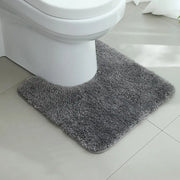 Tapis wc gris anthracite en peluche grise avec texture douce et moelleuse et bords arrondis